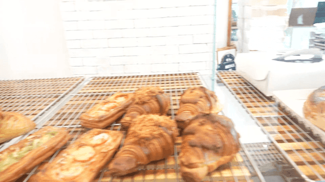 A variety of pastries displayed in a bakery