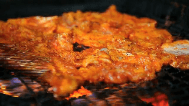 Grilled marinated pork on a barbecue