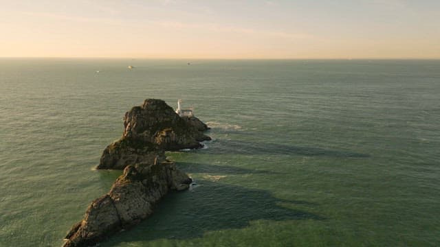 Lighthouse on a rocky island in the sea