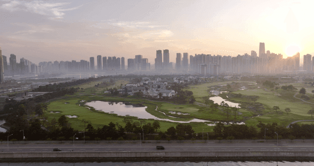 City skyline with a park at sunrise