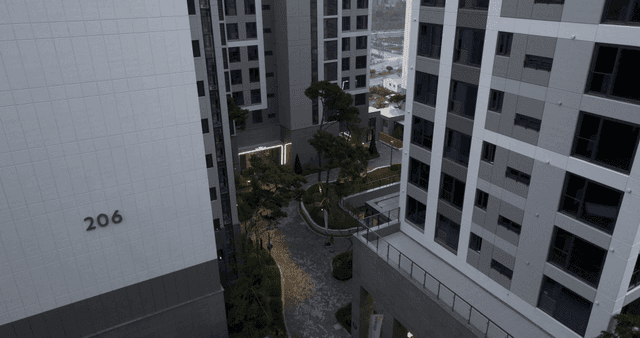 Modern apartment complex with trees