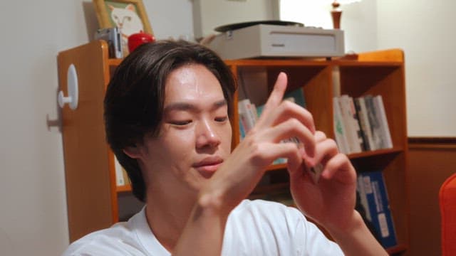 Man playing cards in a cozy room