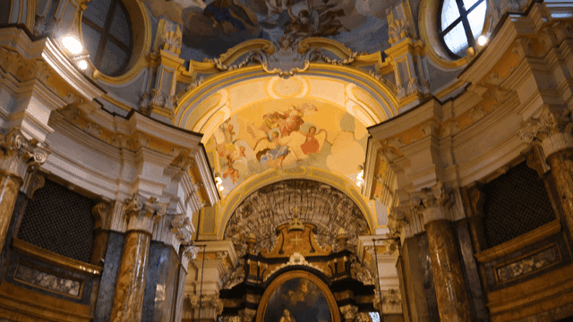 Elaborate cathedral ceiling paintings and altars