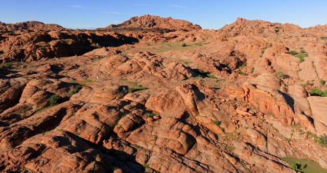 Person standing on rocky mountain