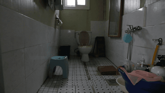 Simple bathroom with basic toilet and faucet