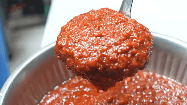 Ladle scooped out thick gochujang sauce