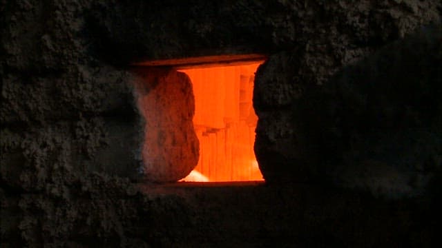 Glowing Forge Through a Small Window