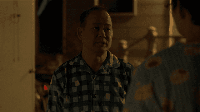 Two people having a conversation at night