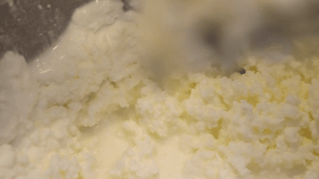 Whipped cream in a mixing bowl