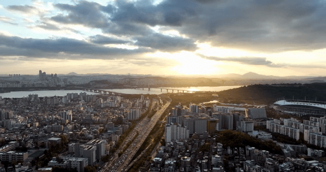 City skyline with river and sunset