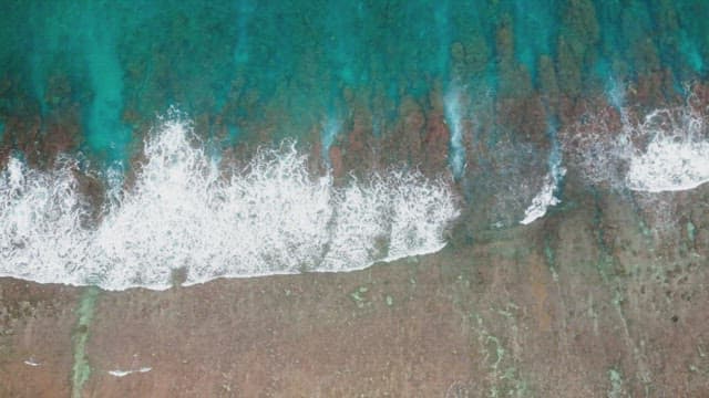 Waves crashing on a sandy beach