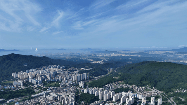 Vast city landscape surrounded by mountains