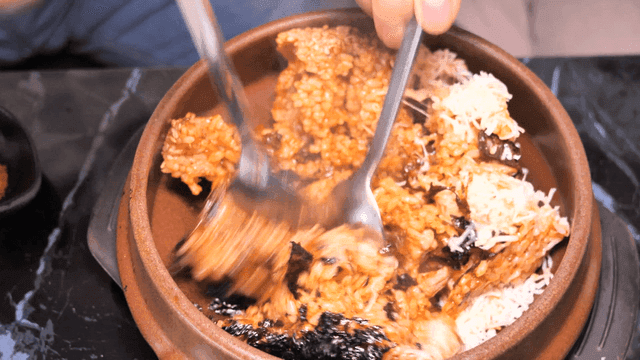 Kimchi fried rice mixed with seaweed and cheese