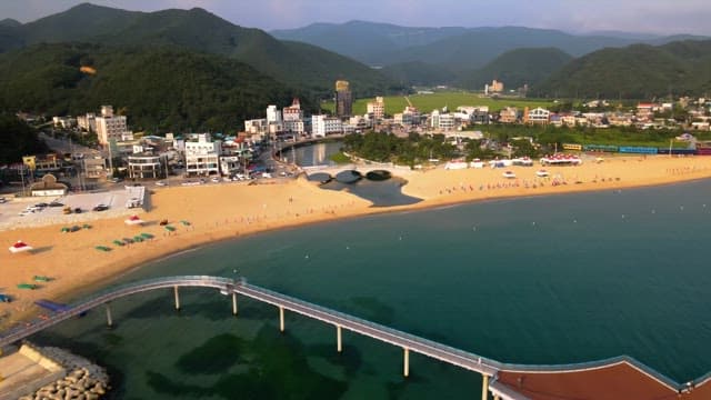 Scenic beach with a nearby town