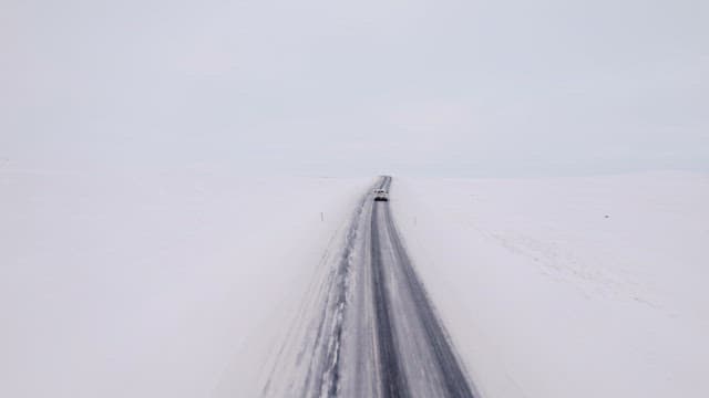Car driving on a snowy road