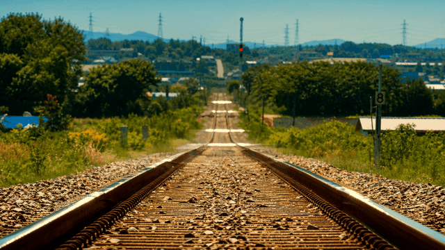 Distant heat haze and straight railway tracks