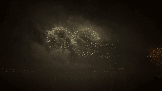 Fireworks display over a city skyline