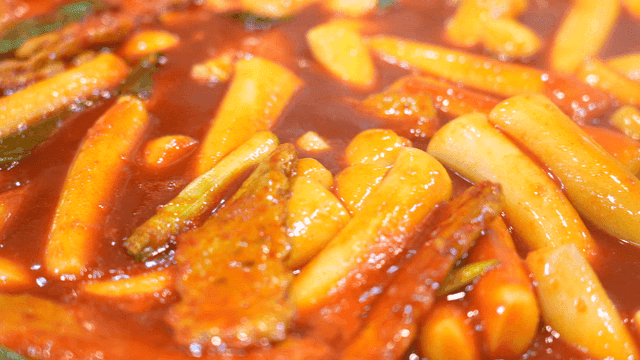 Spicy tteokbokki simmering in a pot