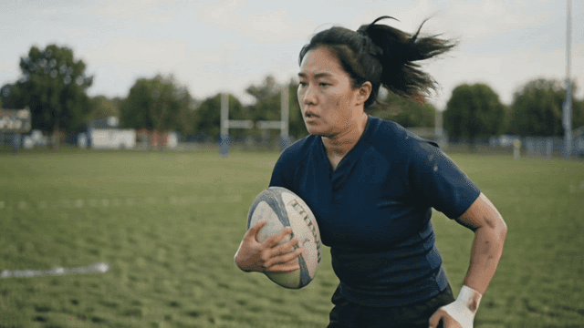 Rugby player running on field
