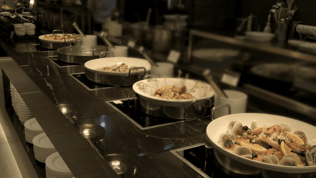 A variety of dishes displayed in a buffet