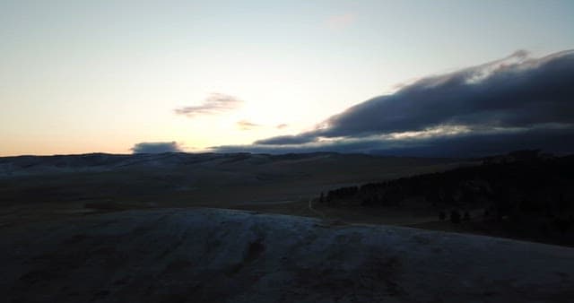 Sunrise over a vast mountain landscape