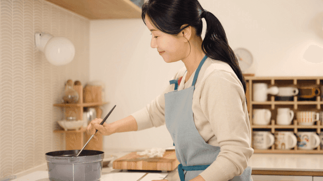 Woman cooking in a cozy kitchen