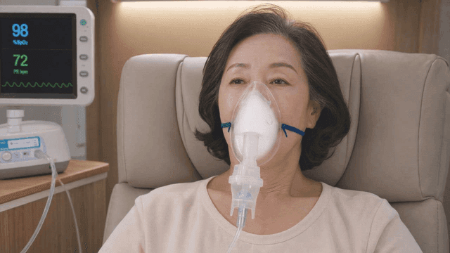 Elderly woman receiving oxygen therapy