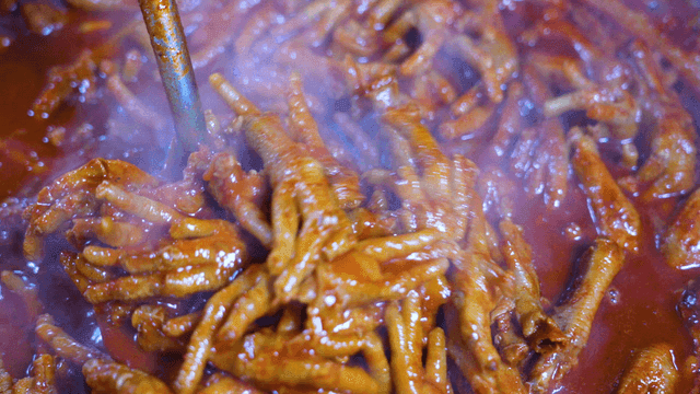 Spicy chicken feet simmered in red sauce