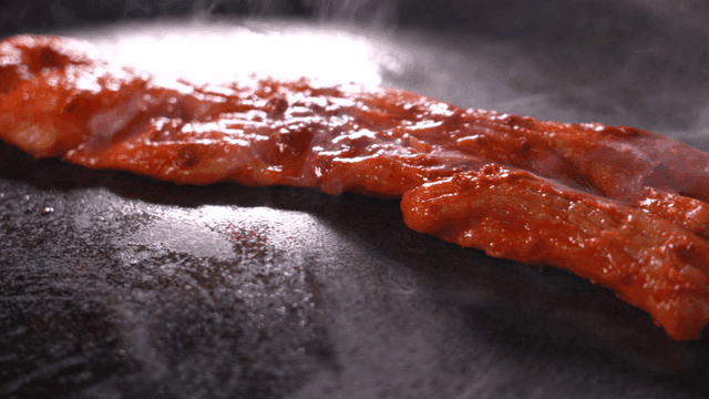 Sizzling seasoned beef tripe grilled on pan