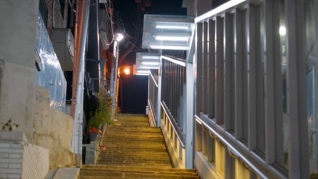 Quiet alley with bright streetlights