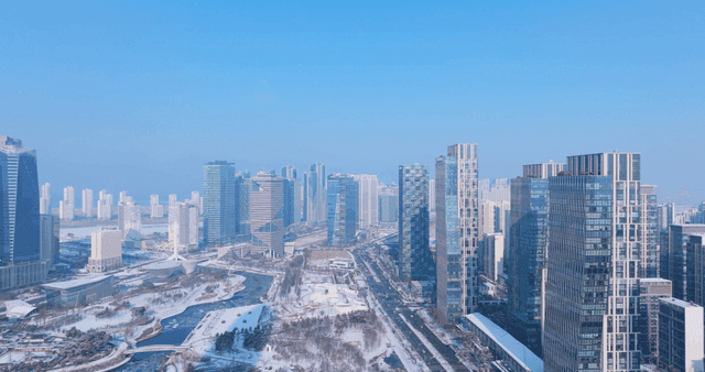 Snow-covered cityscape with tall buildings