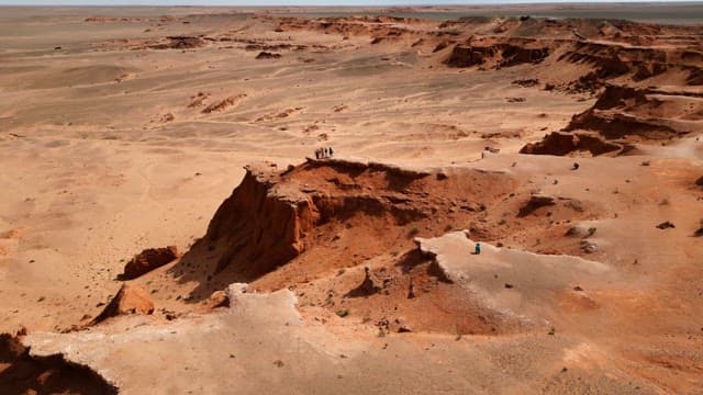 Expansive desert landscape with cliffs