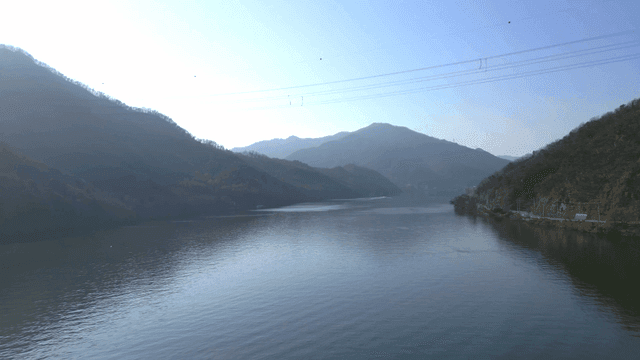 Tranquil lake surrounded by mountains