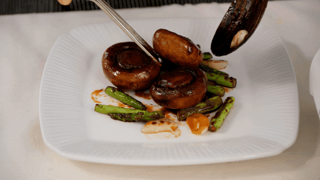 Grilled mushrooms and asparagus on a plate