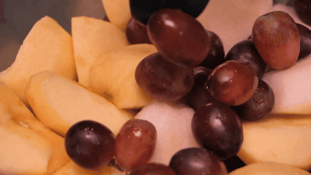 Bowl containing apples and grapes