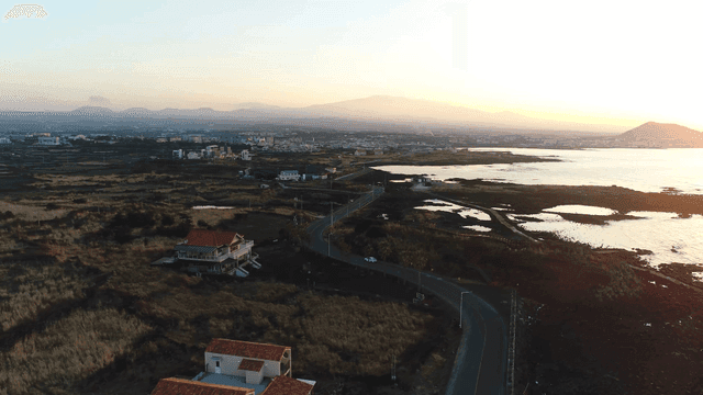 Coastal road and sea at sunrise