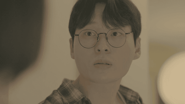 Slightly surprised young man wearing glasses