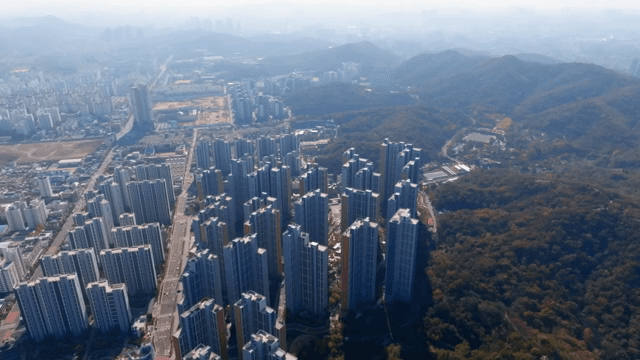 Panoramic view of complex with high-rise apartments