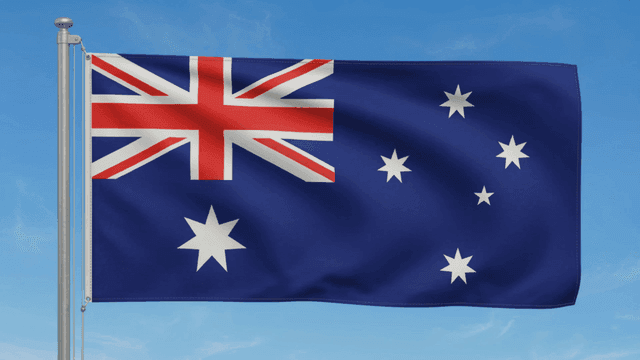 Australian flag waving against a blue sky