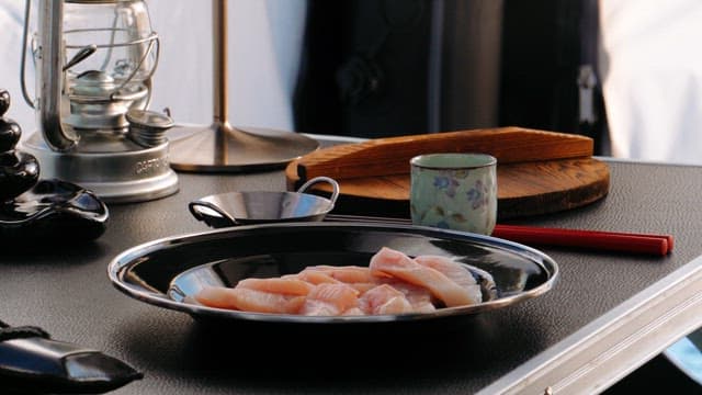 Preparing Fresh Sashimi and Hot Sake