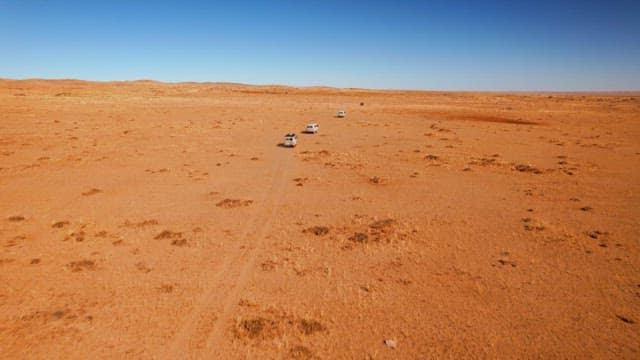 Vehicle Driving in a Barren and Vast Desert