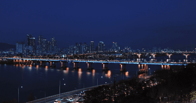 Night view of a city with a busy bridge