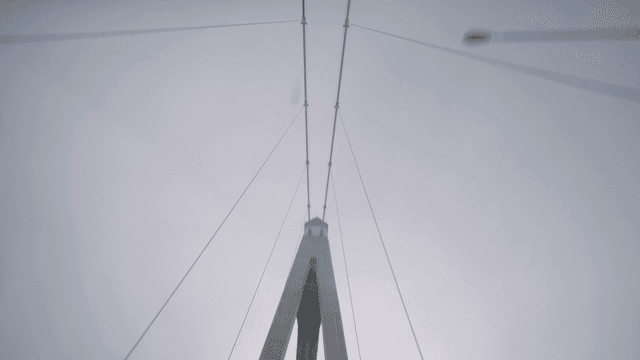 Modern suspension bridge under a cloudy sky