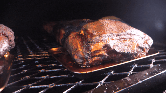 Juicy smoked barbecue meat on grill