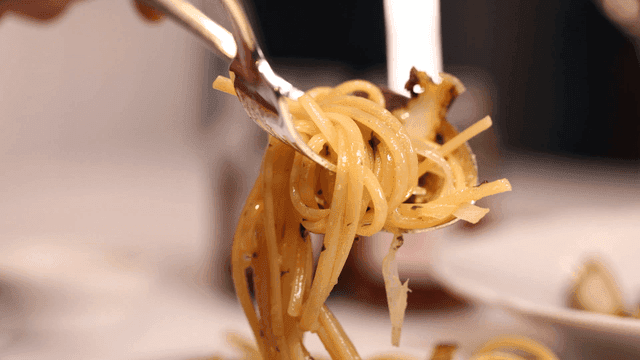 Pasta being twirled on a fork