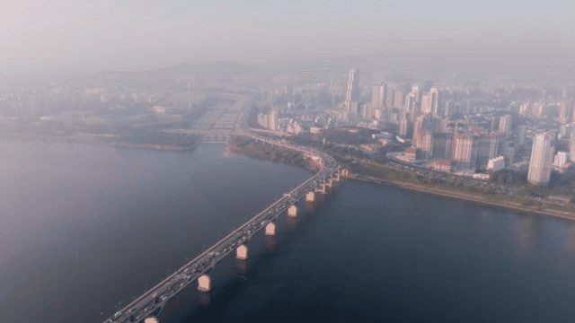 City skyline with a bridge over a river