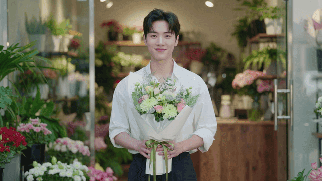 Man holding bouquet at flower shop