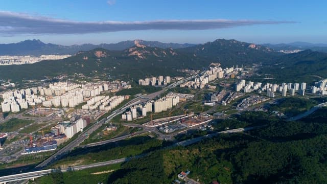 Urban Landscape with Mountainous Backdrop