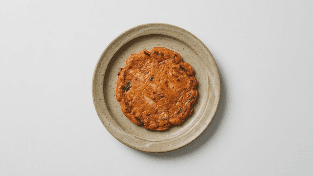 Kimchi pancake on a ceramic plate