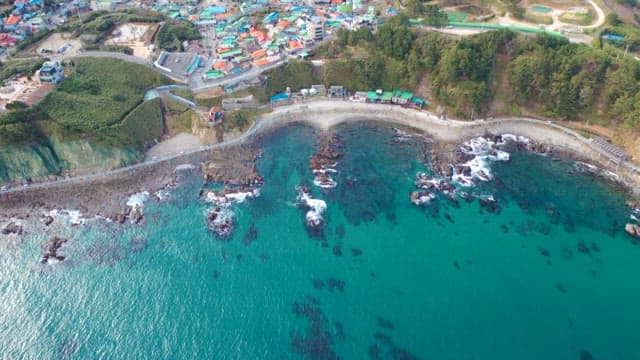 Aerial View of Coastal Village by the Sea